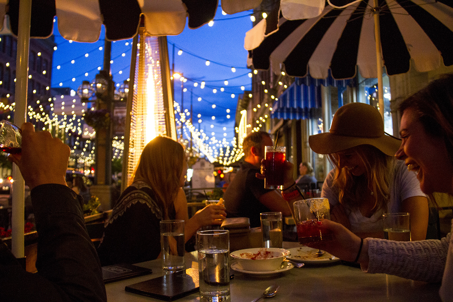 Dining on Tag's patio after dark under Larimer Square's iconic light strings. (Kevin J. Beaty/Denverite)