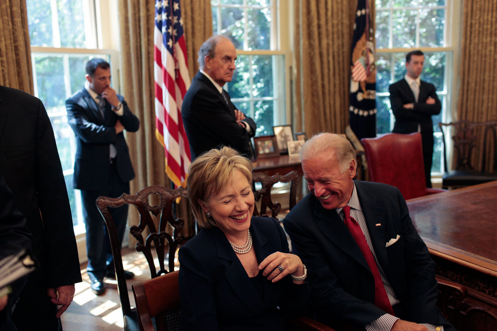 Secretary of State Hillary Clinton laughs at a remark by Vice President Joe Biden as they wait for the start of a press statement by President Barack Obama and Egyptian President Hosni Mubarak in the Oval Office Aug. 18, 2009. (Official White House Photo by Lawrence Jackson/Flickr)
hillary clinton; politics; creative commons; presidential race; election; white house; flickr; denverite