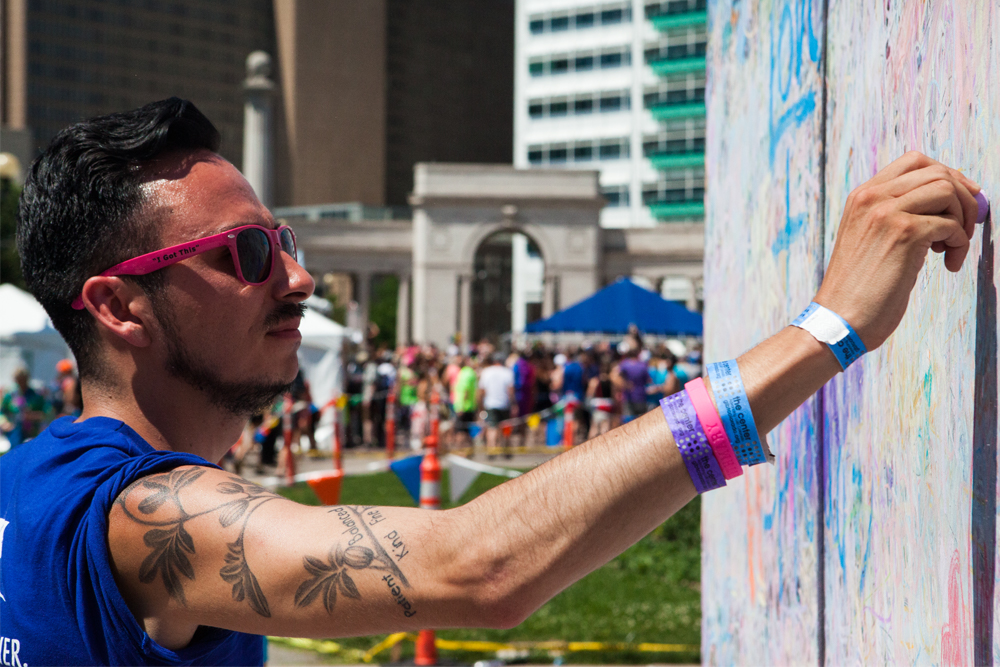 Austin, 25, wrote, "You are in our hearts." He thinks Pride is important because it encourages people to unite in the face of hate. (Chloe Aiello/Denverite)