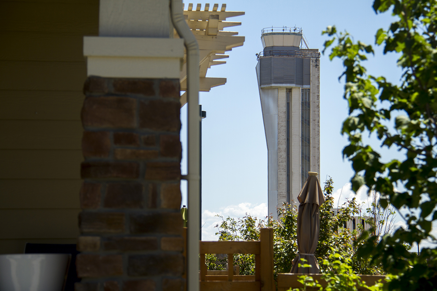 The defunct Stapleton Airport control tower looms over the growing suburban landscape. (Kevin J. Beaty/Denverite)