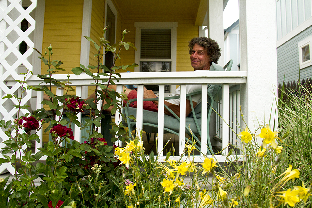Alan Stopper enjoys a warm afternoon on his West Highland porch. (Kevin J. Beaty/Denverite)
west highland; residential; denver; denverite; colorado; kevinjbeaty;