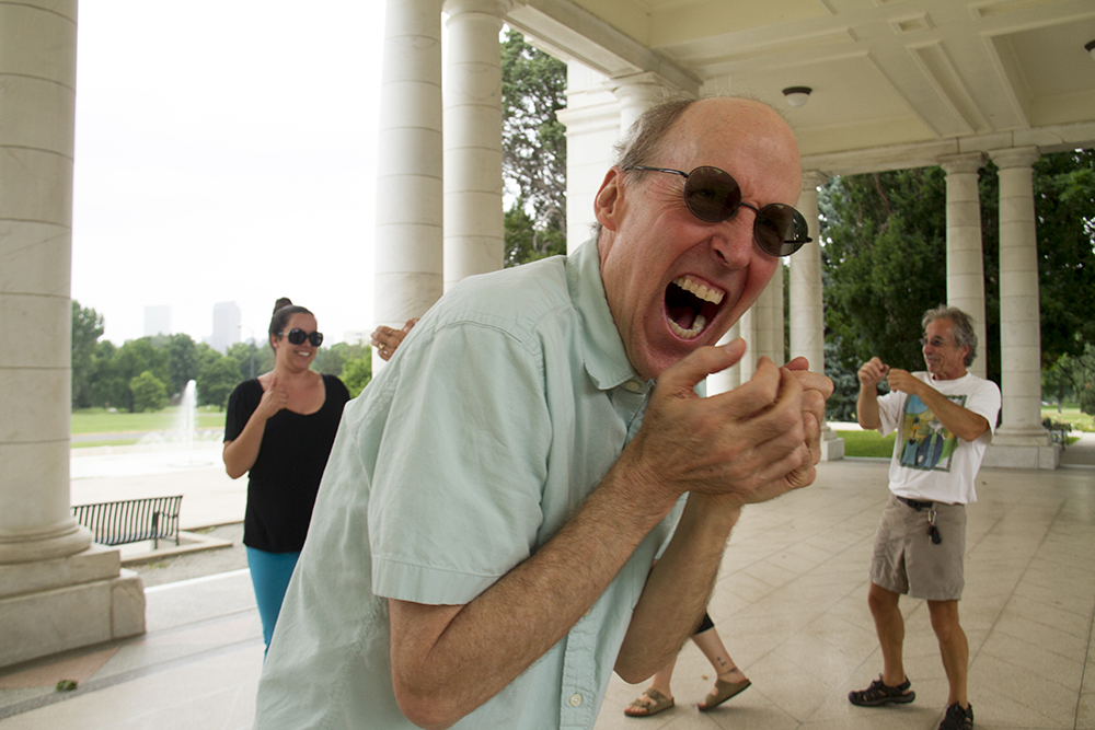 Jeff Johnston calckes during Laughter Yoga under the Walter Scott Cheesman Pavilion at Cheesman Park. (Kevin J. Beaty/Denverite)
park; summer; denver; denverite; colorado; kevinjbeaty