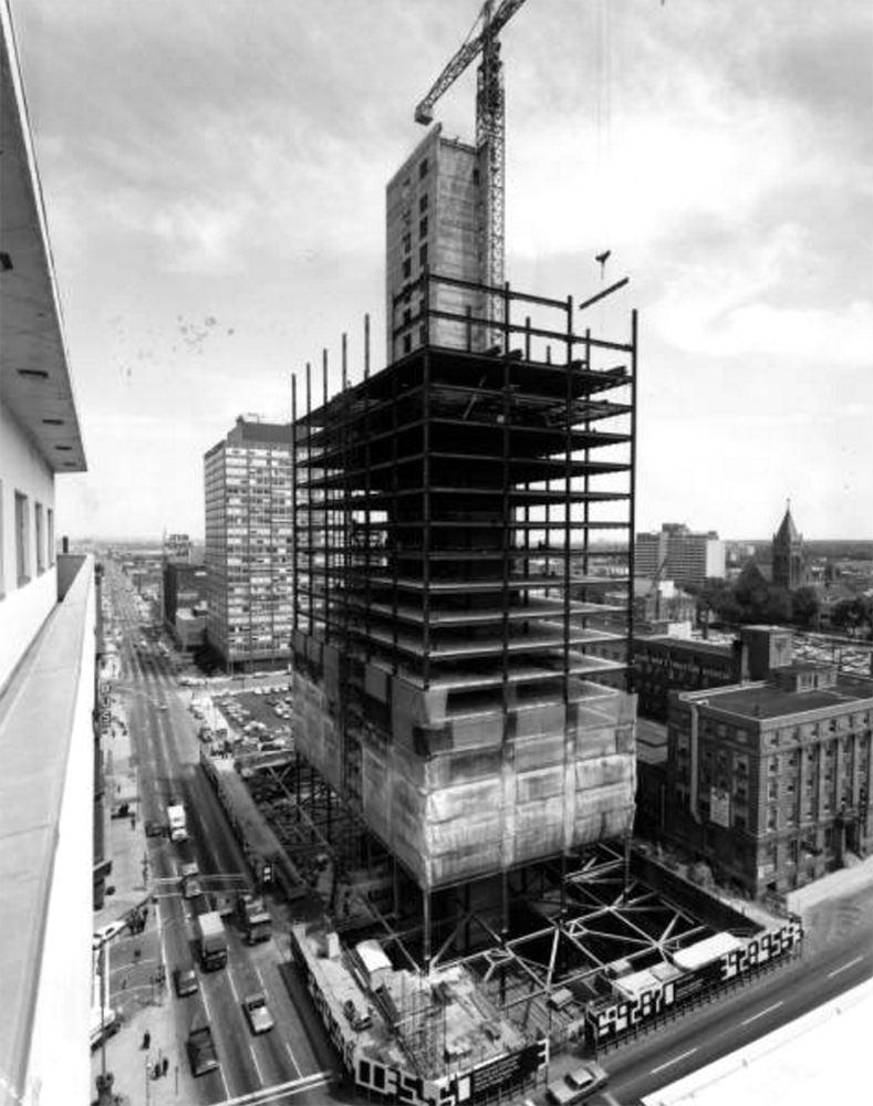 Rooftop view of the partially constructed Colorado State Savings Bank Building at 16th (Sixteenth) Street and Broadway in downtown Denver, Colorado. Automobiles and trucks drive near the skyscraper. A crane is at the construction site. July 28, 1970. (Denver Public Library/Western History Collection/X-24940)
construction; development; colorado state savings bank; denver public library; dpl; archival; archive; historic; denver; colorado; denverite;