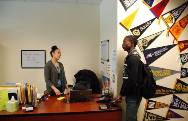 Hinkley College Center director Jazmin Lopez speaks with senior Moise Kombo in January. (Photo by Nicholas Garcia )