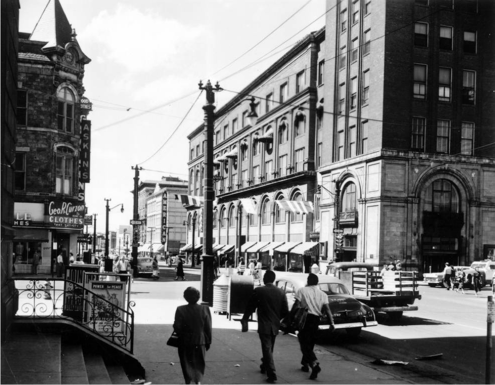 People walk along 16th Street near Arapahoe Street in Denver, near the Daniels & Fisher Building, in 1957. (Denver Public Library/Western History Collection/X-11000120)