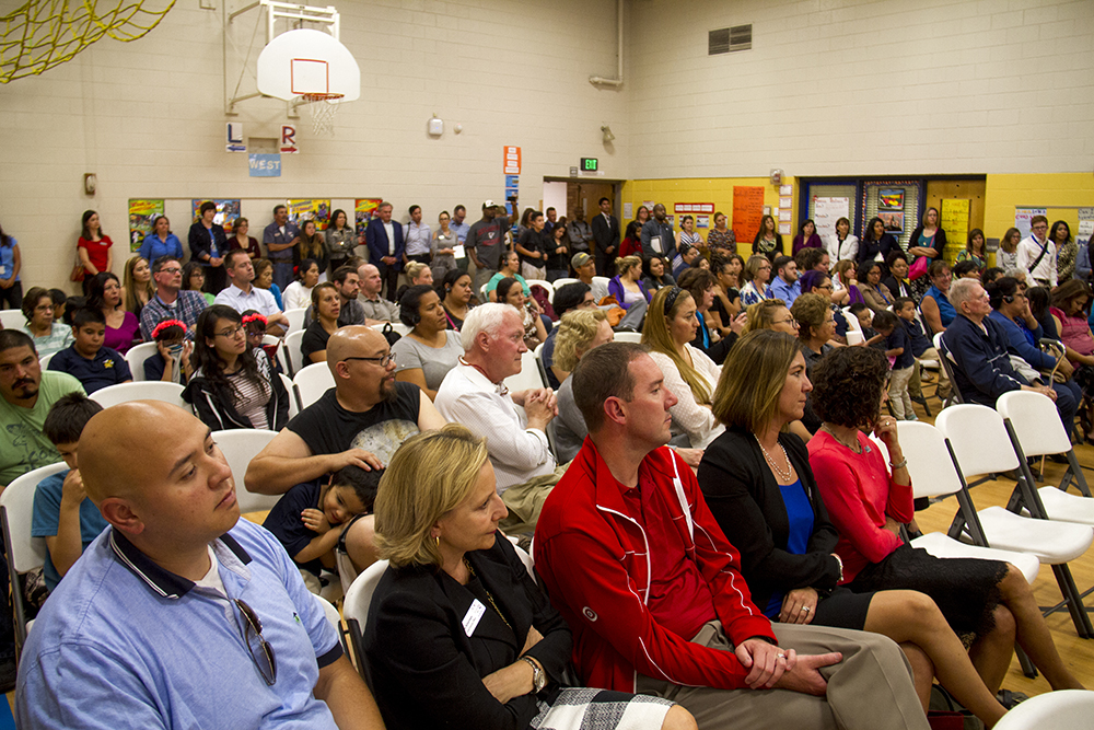 The crowd listens to the mayor speak at Swansea Elementary. (Kevin J. Beaty/Denverite) elyria swansea; swansea elementary; kids; school; hancock; development; gentrification; displacement; kevinjbeaty; denverite; denver; colorado;