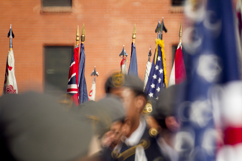 Flags above JROTC students standing in formation before the Veterans Day parade at Civic Center Park. Nov. 12, 2016. (Kevin J. Beaty/Denverite)
veterans day; jrotc; military; civic center park; denver; denverite; colorado; kevinjbeaty;