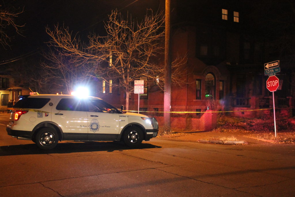 Denver police blocked off the area around a homicide investigation at 13th Avenue and Marion Street. Nov. 22, 2016. (Ashley Dean/Denverite)
