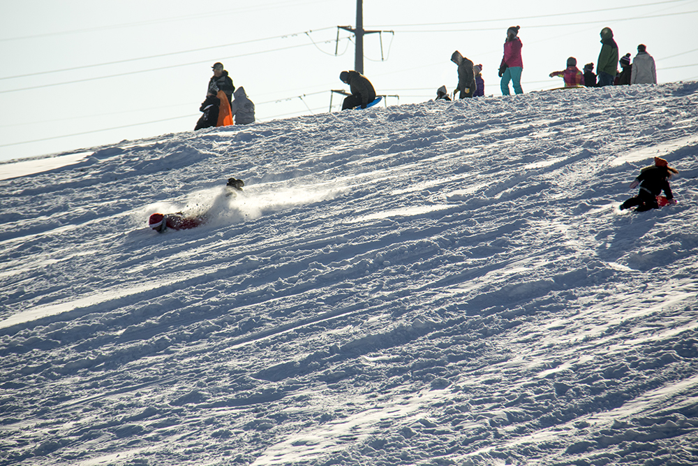 Luke Leins, dressed as Santa, bodyboards Ruby Hill. Dec. 17, 2016. (Kevin J. Beaty/Denverite)
snow day; winter; sledding; denver; denverite; colorado; kevinjbeaty;