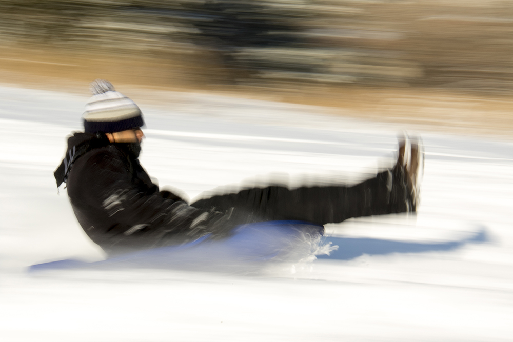 Daniel Esparza zips down Ruby Hill on a sled. Dec. 17, 2016. (Kevin J. Beaty/Denverite)
snow day; winter; sledding; denver; denverite; colorado; kevinjbeaty;