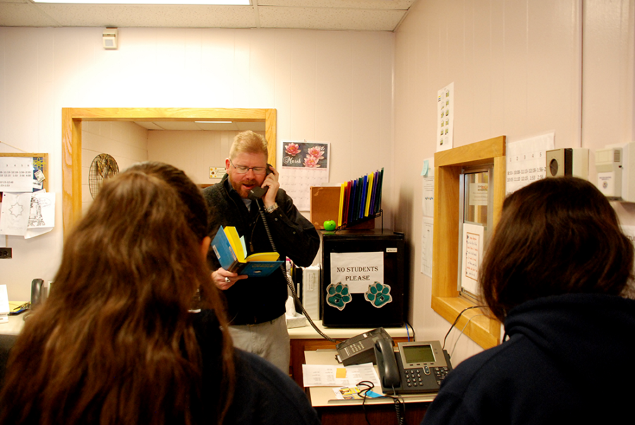 Scott Carpenter principal Chadwick Anderson reads an inspirational quote during the morning announcements. (Nicholas Garcia/Denverite)