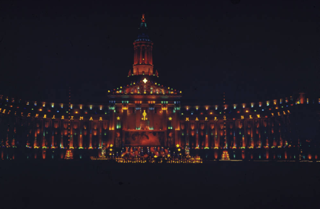 Nighttime view of the City and County Building in Denver, Colorado. The building is decorated with Christmas lights and decorations. (Denver Public Library/Western History Collection/Z-415)