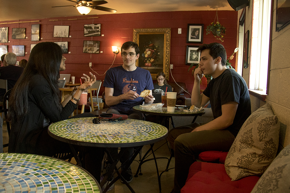 DU students Shree (left to right), Noah and Nick chat at La Belle Rosette. (Kevin J. Beaty/Denverite) university of denver; du; kevinjbeaty; denverite; denver; colorado; coffee; food;