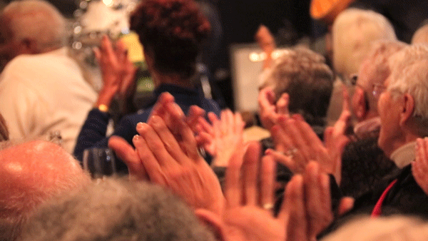 The audience cheers at the end of Friday lunch at Dazzle Jazz. (Kevin J. Beaty/Denverite)