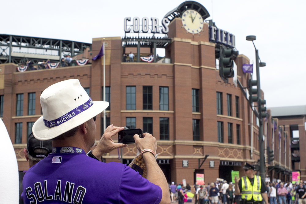 A man takes a photo of Coors Field on opening day, April 7, 2017. (Kevin J. Beaty/Denverite)
rockies; ballpark; coors field; sports; baseball; opening day; denver; colorado; denverite; kevinjbeaty;