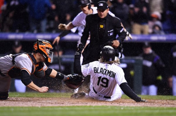 Charlie Blackmon slides in for the inside-the-park home run. (Ron Chenoy/USA Today Sports)