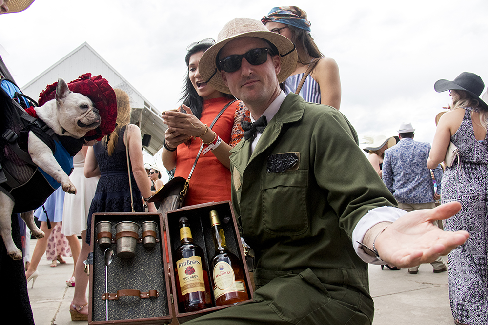 Pith-hatted Paul Laurie has a chest containing a field bar. A Kentucky Derby party at Stanley Marketplace, May 6, 2017. (Kevin J. Beaty/Denverite)
stanley marketplace; kentucky derby; aurora; kevinjbeaty; denverite; colorado;