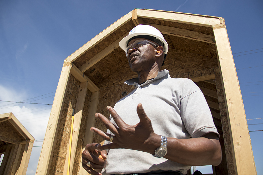 Mennonite Disaster Service volunteer James Harrell gives a tour of construction at the Beloved Community Village at Walnut and 38th streets, May 31, 2017. (Kevin J. Beaty/Denverite)
tiny home village; homeless; right to rest; urban camping ban; denver; colorado; denverite; five points; kevinjbeaty;