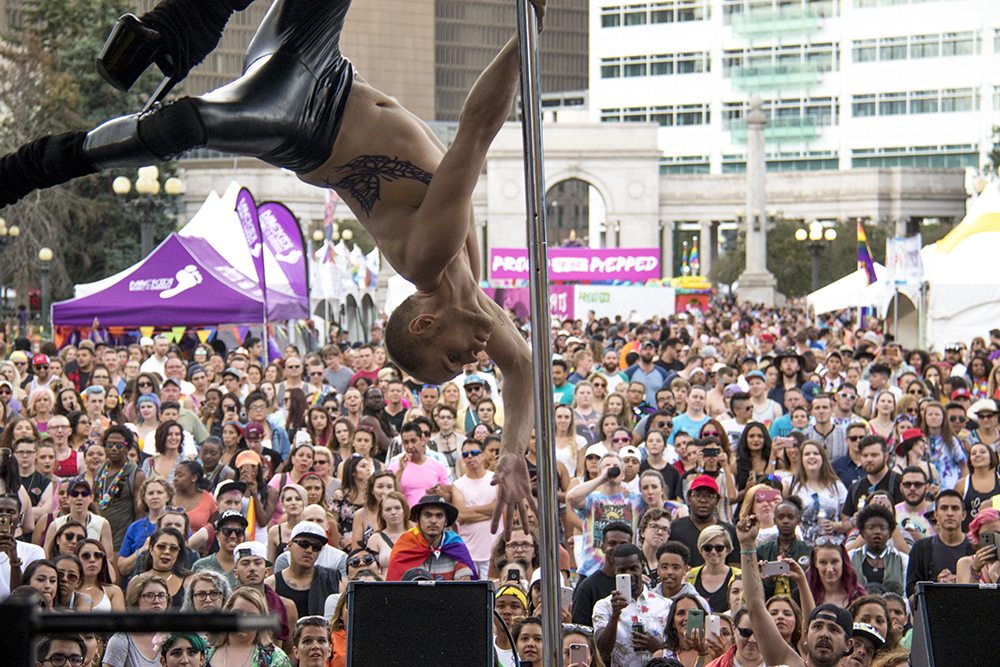 Brian Wolf floats updise down on a pole. Denver PrideFest, June 17, 2017. (Kevin J. Beaty/Denverite)
pride; lgbtq; kevinjbeaty; denver; denverite; colorado; civic center park;