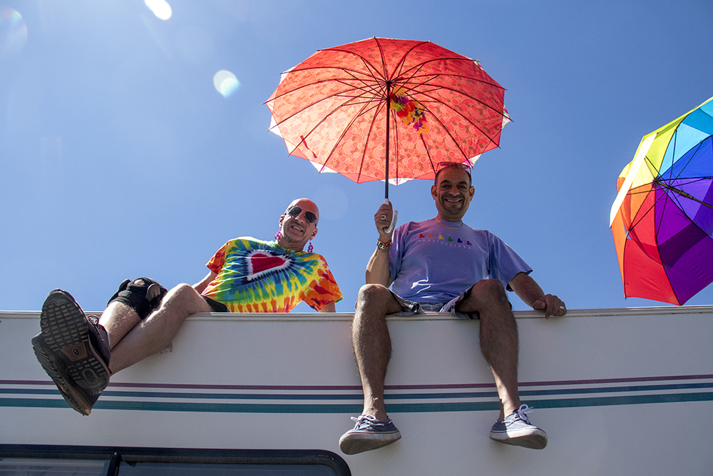 Brent Burnham (left) and Wiz Torres watch the parade from atop a parked camper. Denver PrideFest parade, June 18, 2017. (Kevin J. Beaty/Denverite)
pride; lgbtq; kevinjbeaty; denver; denverite; colorado; parade; colfax;