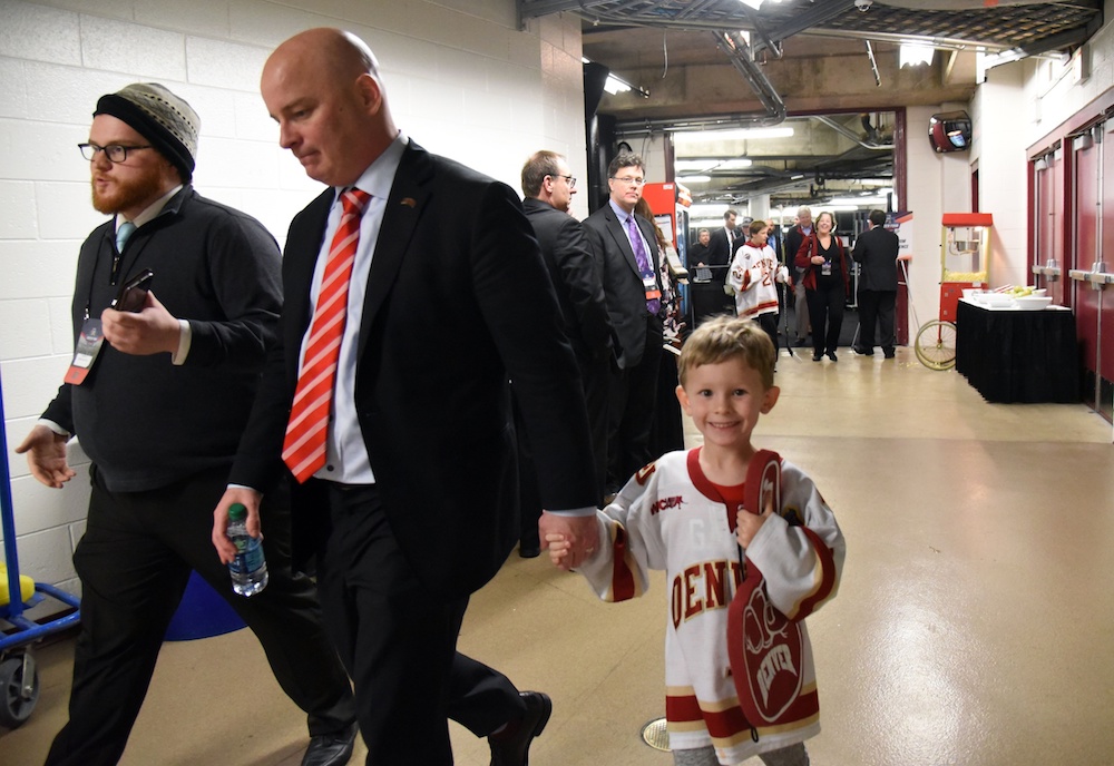 Jim Montgomery, center, will stay on as Denver's head coach. (David Banks/USA Today Sports)