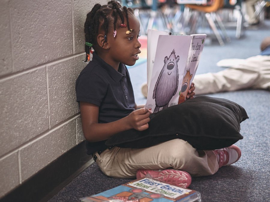 A McGlone first-grader practices her reading. (Roy Barnett/McGlone)
