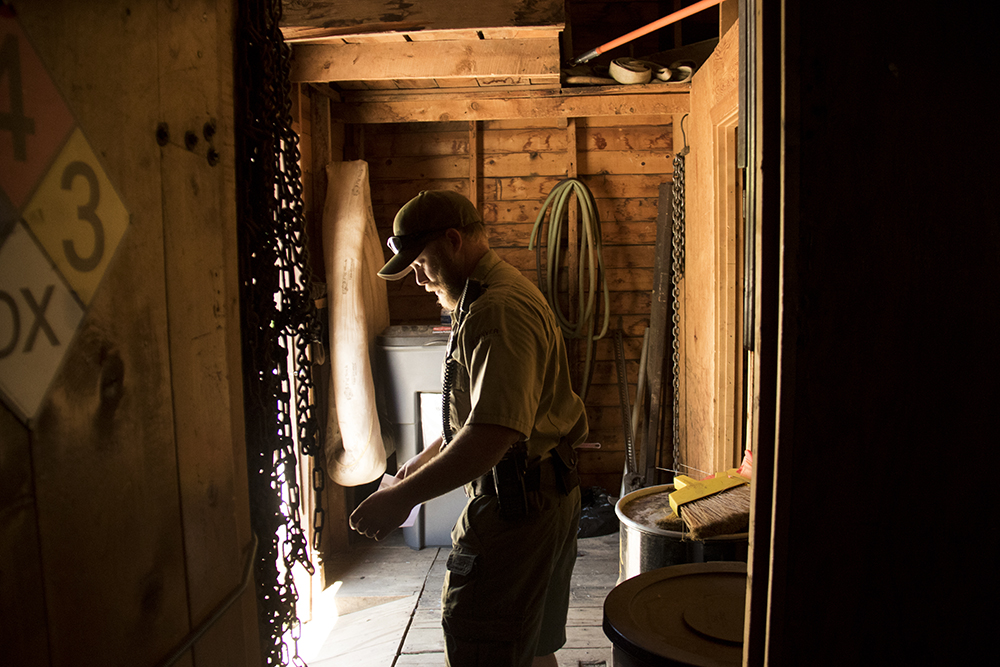 Park Ranger Ryan Phillian inside an old CCC cabin. Red Rocks, July 11, 2017. (Kevin J. Beaty/Denverite) red rocks; Civilian Conservation Corps; history; kevinjbeaty; morrison; colorado; denverite;