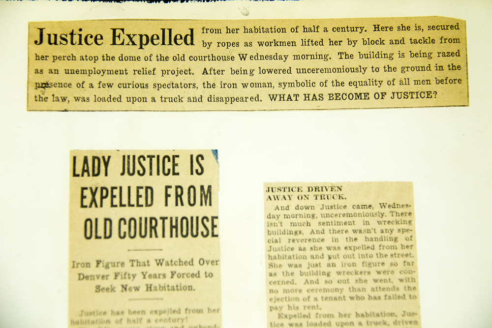 Headlines about Lady Justice being removed from atop Arapahoe County courthouse during its demolition. (Denver Public Library/Western History Collection/George D. Begole Papers) arapahoe courthouse; history; archival; downtown; denver public library; colorado; denverite