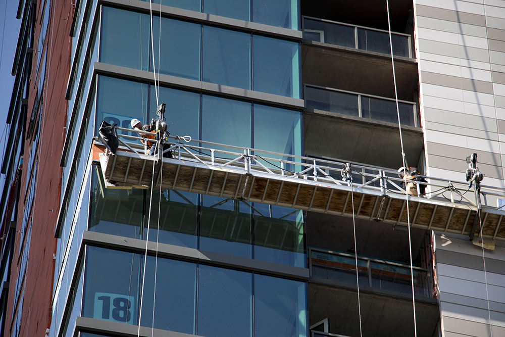 Workers put finishing touches on Country Club Towers, Aug. 16, 2017. (Kevin J. Beaty/Denverite)
country club towers; residential real estate; apartment building; denver; colorado; denverite; kevinjbeaty; denver architectural foundation;