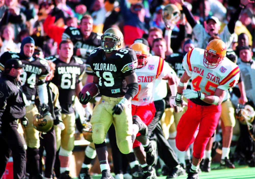 Rashaan Salaam goes over the 2,000-yard mark against Iowa State. (Rocky Mountain News Photograph Collection/Denver Public Library/Western History Collection/RMN-048-9135)