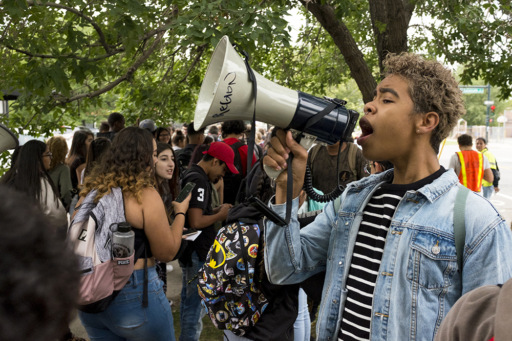 Kendrick Pacheco Fluker yells to high school students, most from Denver Center For International Studies, who walked out of class to attend a rally on the Auraria campus after the repeal of DACA, Sept. 5, 2017. (Kevin J. Beaty/Denverite)
daca; undocumented; immigration; tivoli student union; auraria campus; rally; protest; walkout; kevinjbeaty; denver; denverite; colorado;