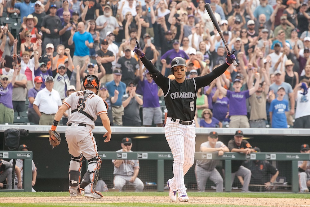 Carlos Gonzalez celebrates after a walk-off walk. ( Isaiah J. Downing/USA Today Sports)