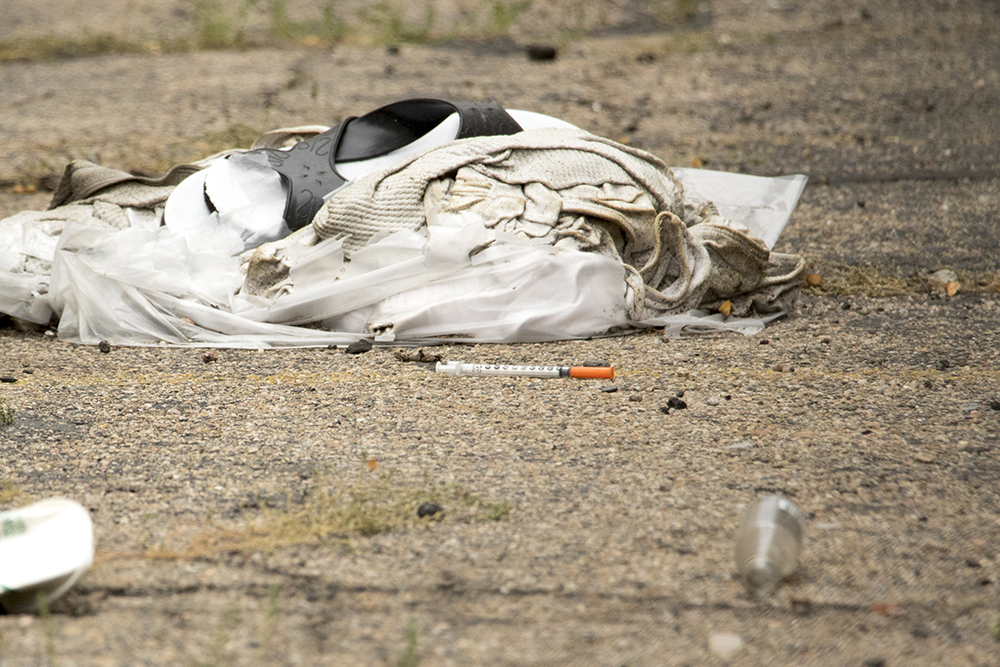 A needle in an alley near Colfax. (Kevin J. Beaty/Denverite)