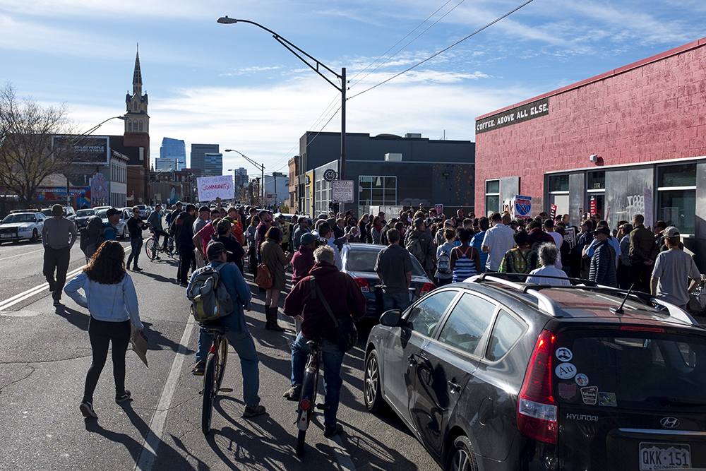 The protest spilled into the street. A rally against Ink! Coffee in Five Points, Nov. 25, 2017. (Kevin J. Beaty/Denverite) kevinjbeaty; denver; denverite; colorado; ink coffee; five points; rino; gentrification; protest;