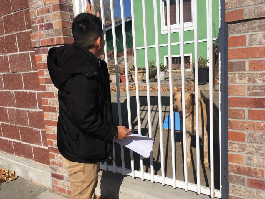 Bonifacio Sanchez Flores, a social worker at Grant Beacon Middle School, visits the home of a student who didn't come to school on Halloween. (Ann Schimke/Chalkbeat)