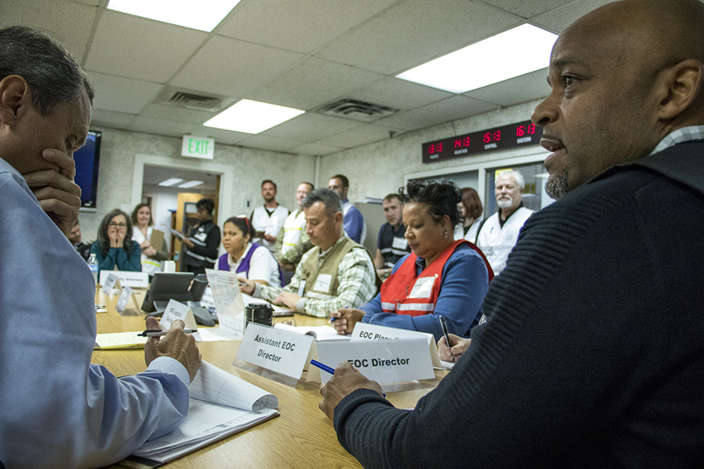Mayor Michael Hancock runs the mock emergency as he would in the event of a real situation. The Denver Office of Emergency Management practices a worst-case security scenario in their basement offices in the City and County Building, Dec. 15, 2017. (Kevin J. Beaty/Denverite)