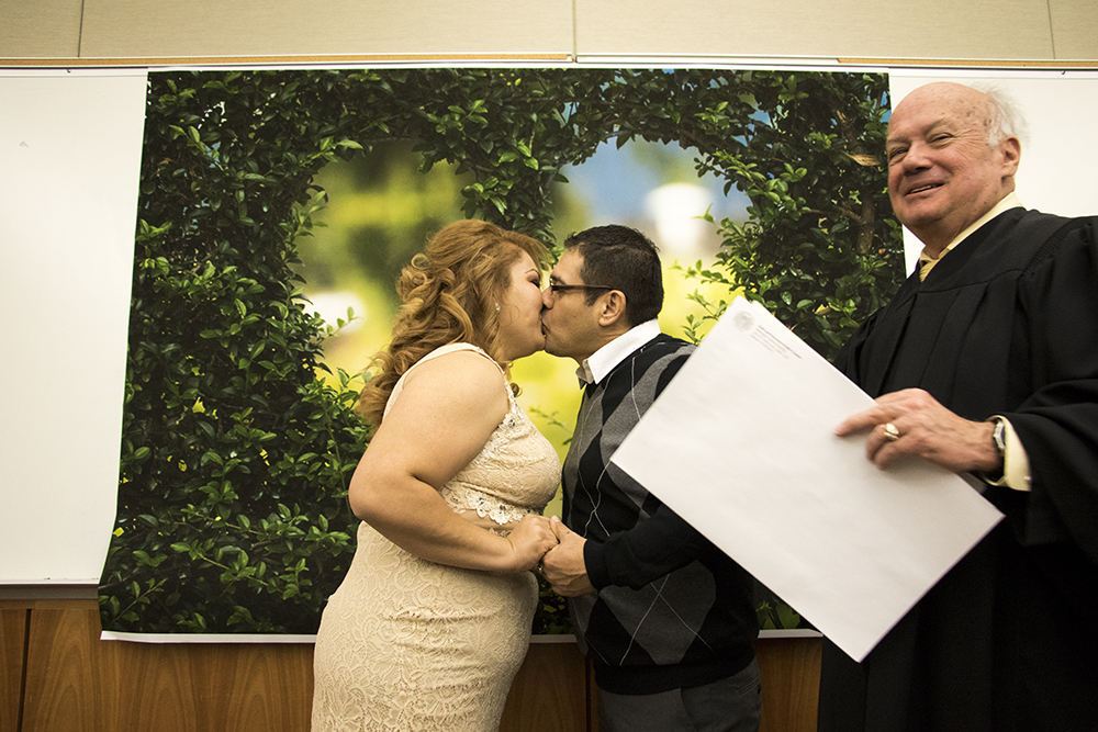 Arturo Gonzalez Munetones and Jackeline Morales Borjas tie the knot on Valentine's Day at the Wellington E. Webb Municipal Office Building, Feb. 14, 2018. (Kevin J. Beaty/Denverite)