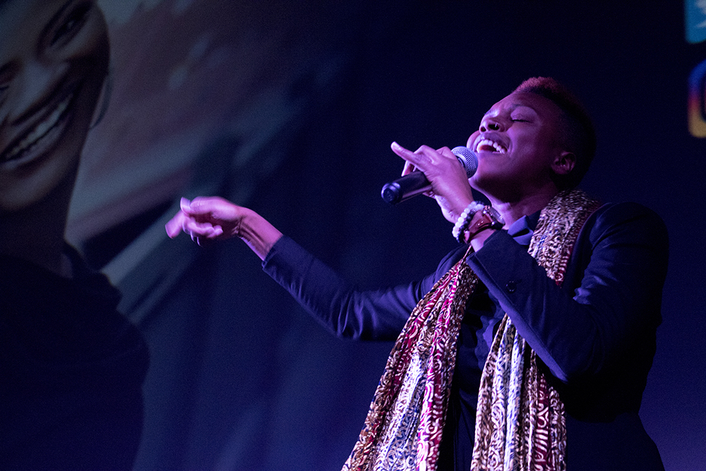 Kerrie Joy performs a slam poem to open a program celebrating the release of Black Panther on Feb. 16, 2018. (Kevin J. Beaty/Denverite)