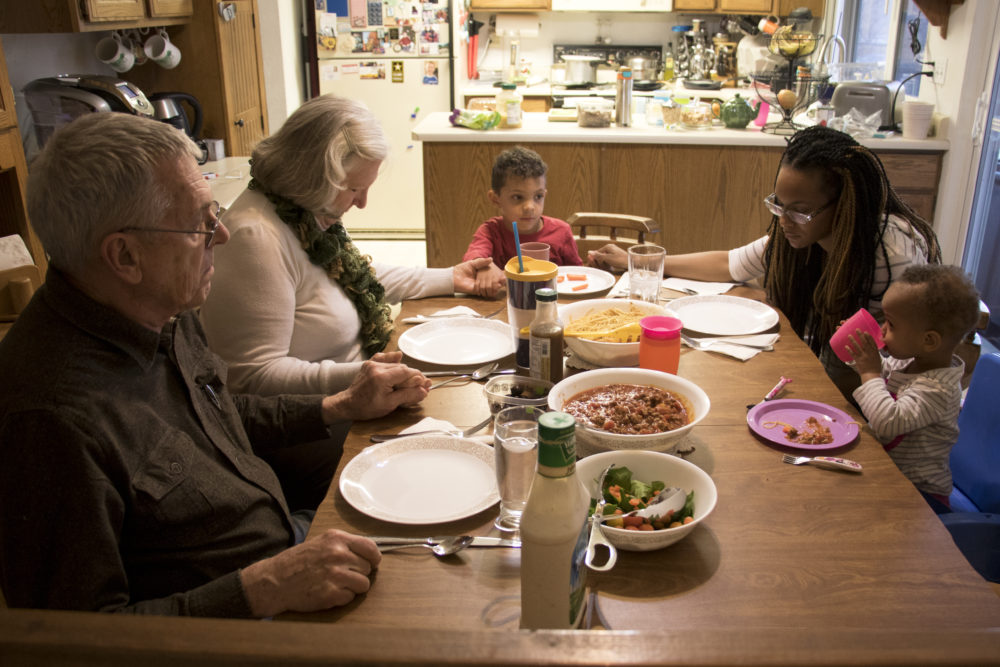 Prayer before dinner at Dave and Dottie Wire's house, which they share with Monica and her two kids, March 16, 2018. (Kevin J. Beaty/Denverite)
shared housing; denver; colorado; residential real estate; families; denverite; kevinjbeaty; colorado;