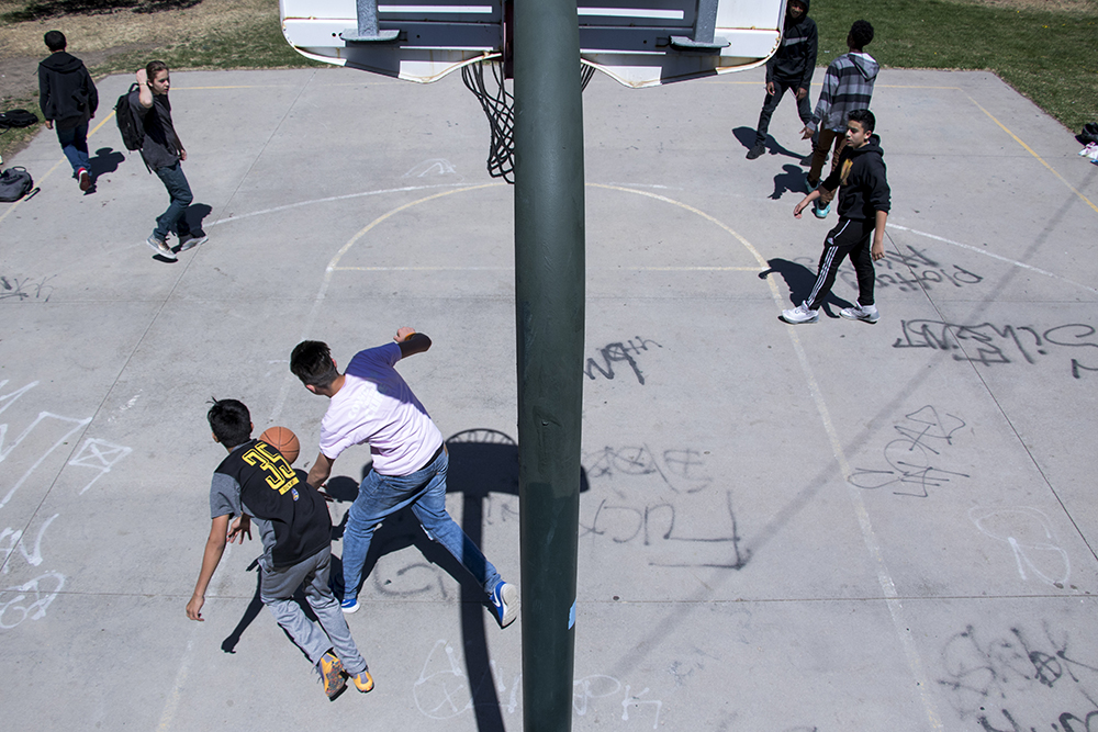 West Early College students play basketball at Sunken Gardens Park, April 18, 2018. (Kevin J. Beaty/Denverite)