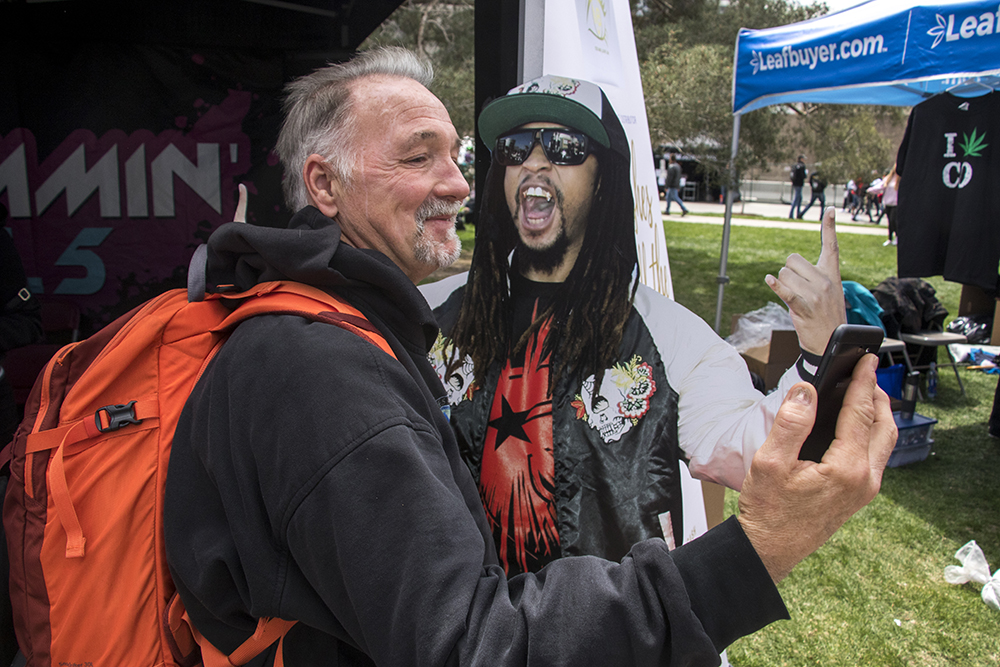 Joe Grissom from Wisconsin takes a selfie with a Lil Jon cutout. Denver's 2018 Mile High 420 Festival, April 20, 2018. (Kevin J. Beaty/Denverite)
420; stoner; denver; denverite; colorado; kevinjbeaty;