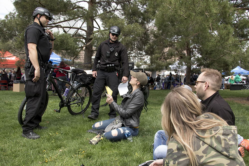 Denver Police officers write public consumption tickets. Denver's 2018 Mile High 420 Festival, April 20, 2018. (Kevin J. Beaty/Denverite)
420; stoner; denver; denverite; colorado; kevinjbeaty;