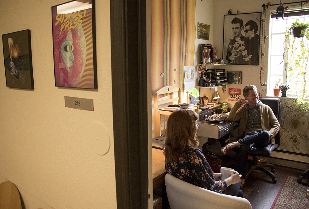 Suspect Press Senior Editor Josiah Hesse (right) and Editor In Chief Amanda E.K. in their headquarters above City O' City, April 26, 2018. (Kevin J. Beaty/Denverite)
