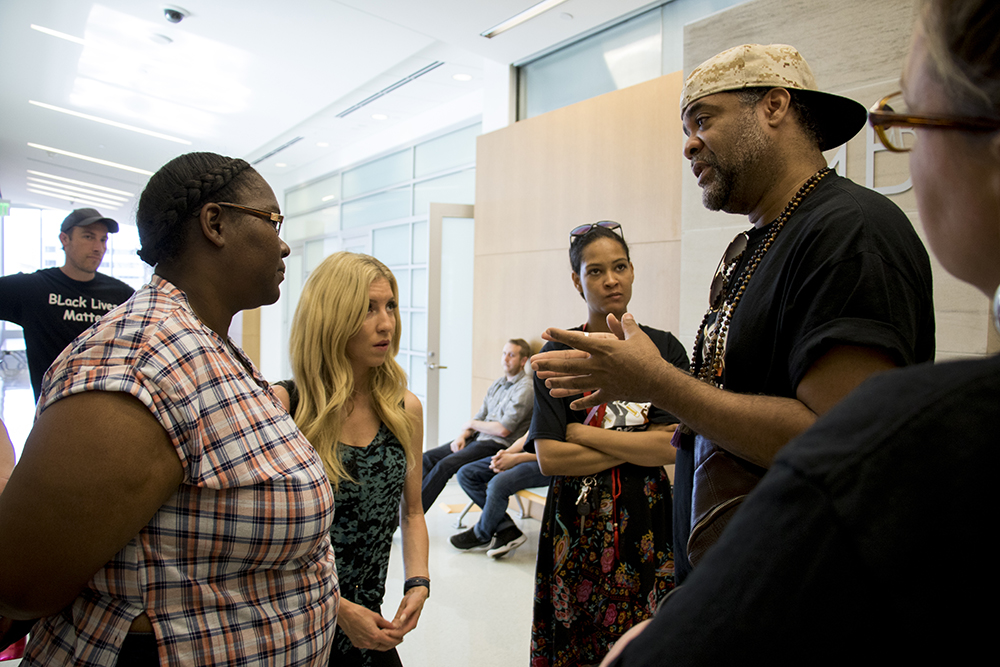 Hasira "Soul" Ashemu (right) speaks to Sheena Gordon, whose daughters were involved in a fight that resulted in charges. Our Voice Our Schools activists have shown up to the Lindsey-Flanigan Courthouse to protest their appearance in court, May 24, 2018. (Kevin J. Beaty/Denverite)
denver; colorado; denverite; kevinjbeaty; lindsey-flanigan courthouse; criminal justice; school to prison pipeline;