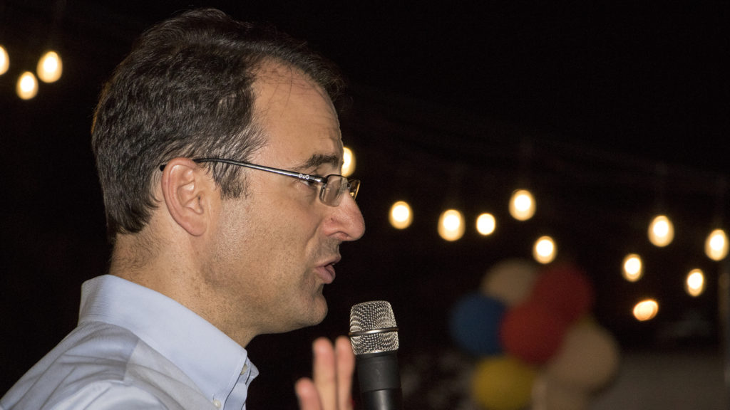 Phil Weiser adjourns his supporters after results in the attorney general race was still inconclusive late into his watch party at Backyard On Blake in RiNo, June 26, 2018. (Kevin J. Beaty/Denverite)