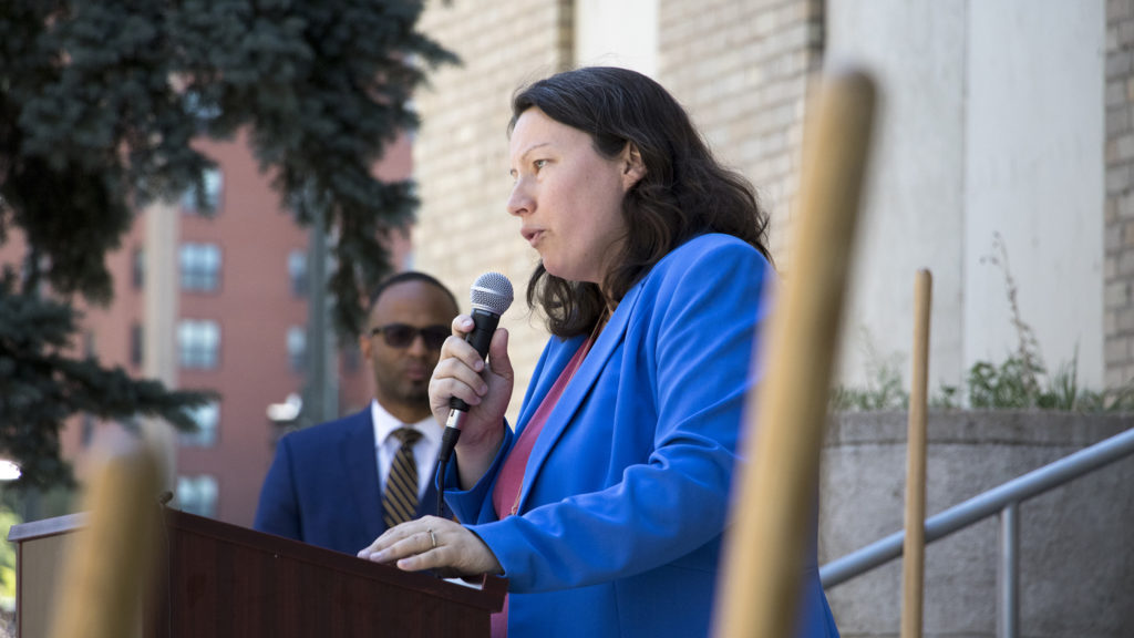 Britta Fisher, chief housing officer at Denver's Office of Economic Development, speaks at a groundbreaking for Tammen Hall on the campus of Saint Joseph Hospital, June 26, 2018. (Kevin J. Beaty/Denverite)