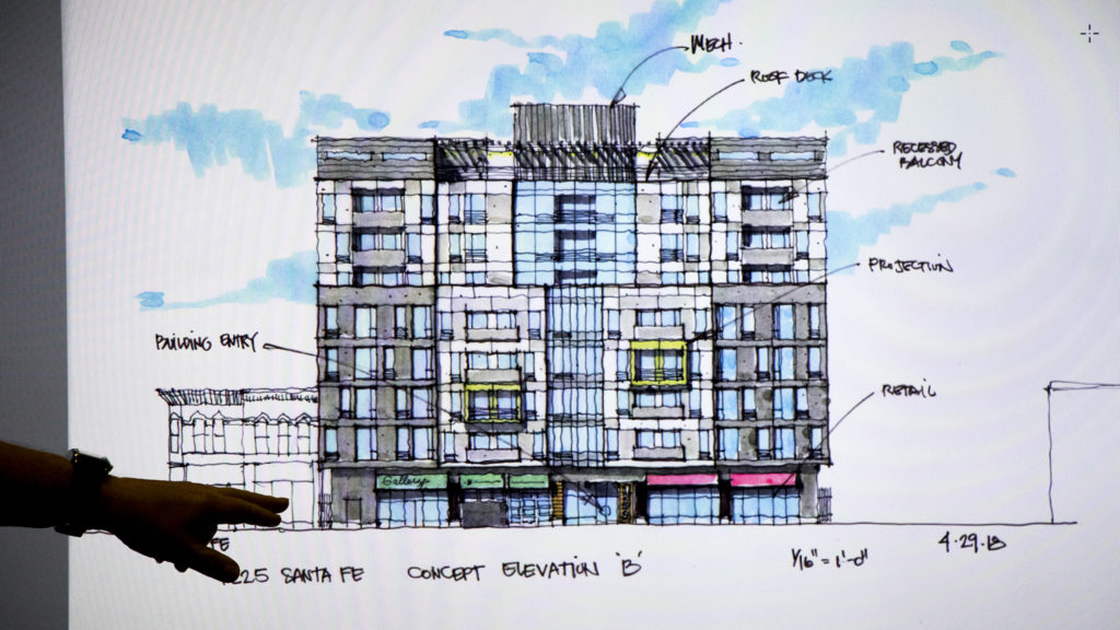 Designer Bruce Ivins presents a revised design of a building to be constructed at 1225 Santa Fe Drive to the La Alma-Lincoln Park Neighborhood Association during their monthly meeting at Youth On Record, June 27, 2018. (Kevin J. Beaty/Denverite)