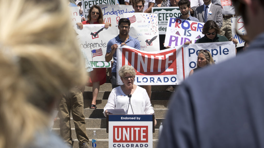 Maile Foster, an independent running for House District 18, speaks at a rally hosted by Unite Colorado supporting five independent candidates running for state offices, July 9, 2018. (Kevin J. Beaty/Denverite)