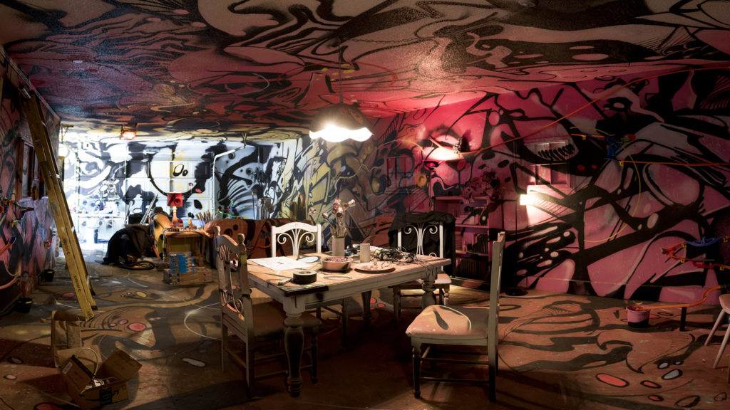 Warm Cookies of the Revolution puts the finishing touches on "This Machine Has A Soul," an art installation meant to get people thinking about participatory budgeting, Aug. 15, 2018. (Kevin J. Beaty/Denverite)