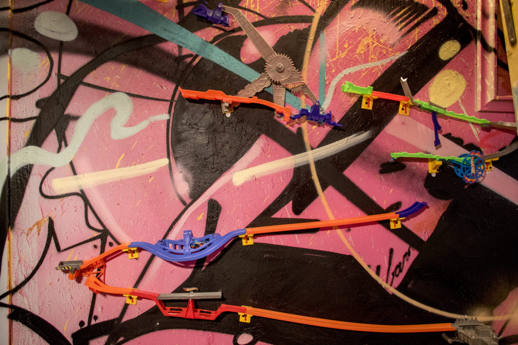 Hot Wheels car tracks snake around "This Machine Has A Soul," an art installation by Warm Cookies of the Revolution meant to get people thinking about participatory budgeting, Aug. 15, 2018. (Kevin J. Beaty/Denverite)